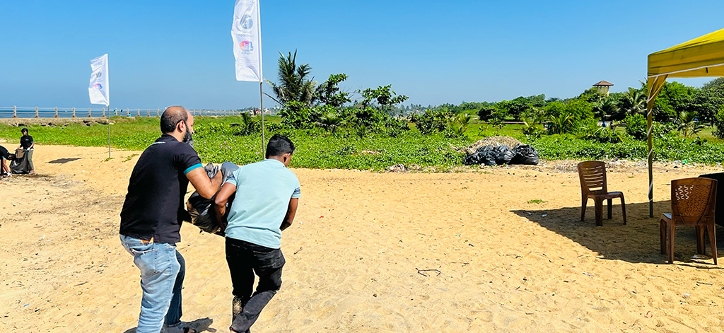swivel foundation volunteers disposing trash found on the beach